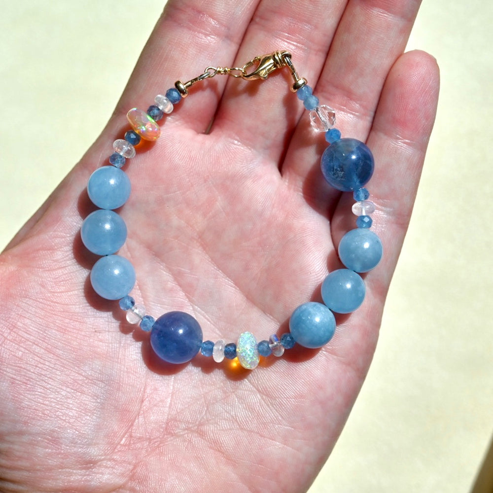 14K gold aquamarine bracelet blue fluorite moonstone opal beaded gemstone jewelry luxury piece OpalOra. Blue bracelet in 14k yellow gold.