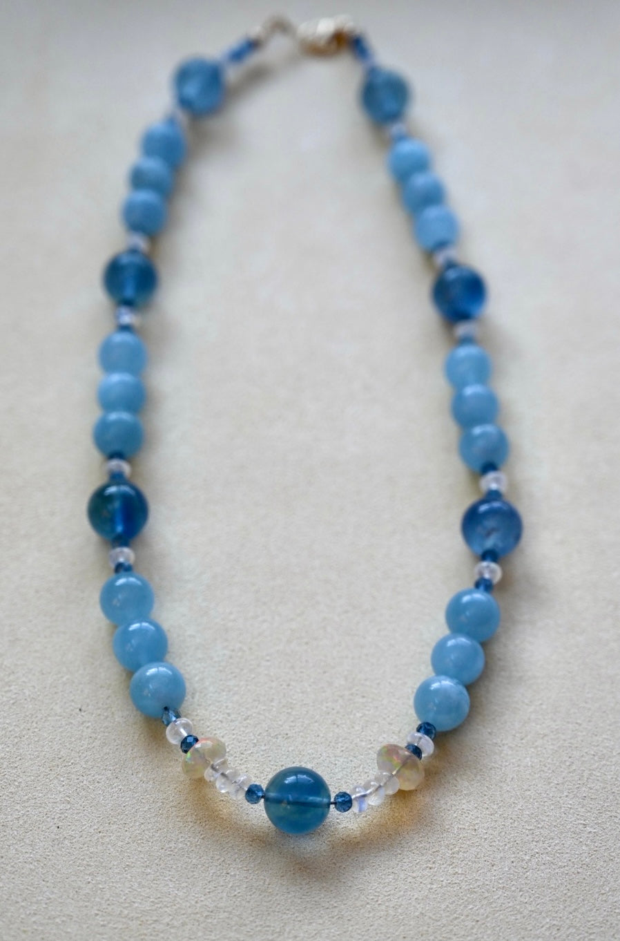 Aquamarine and blue fluorite necklace with 14K gold beads, large lobster clasp, and finishing beads.