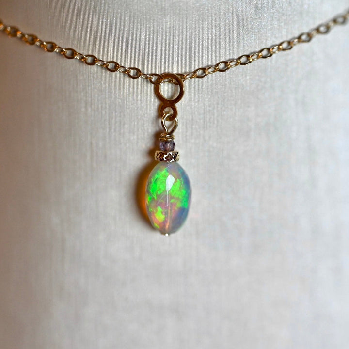 Side view of dark opal pendant with 14K solid gold bail and spinel gemstone, 3.4 carats