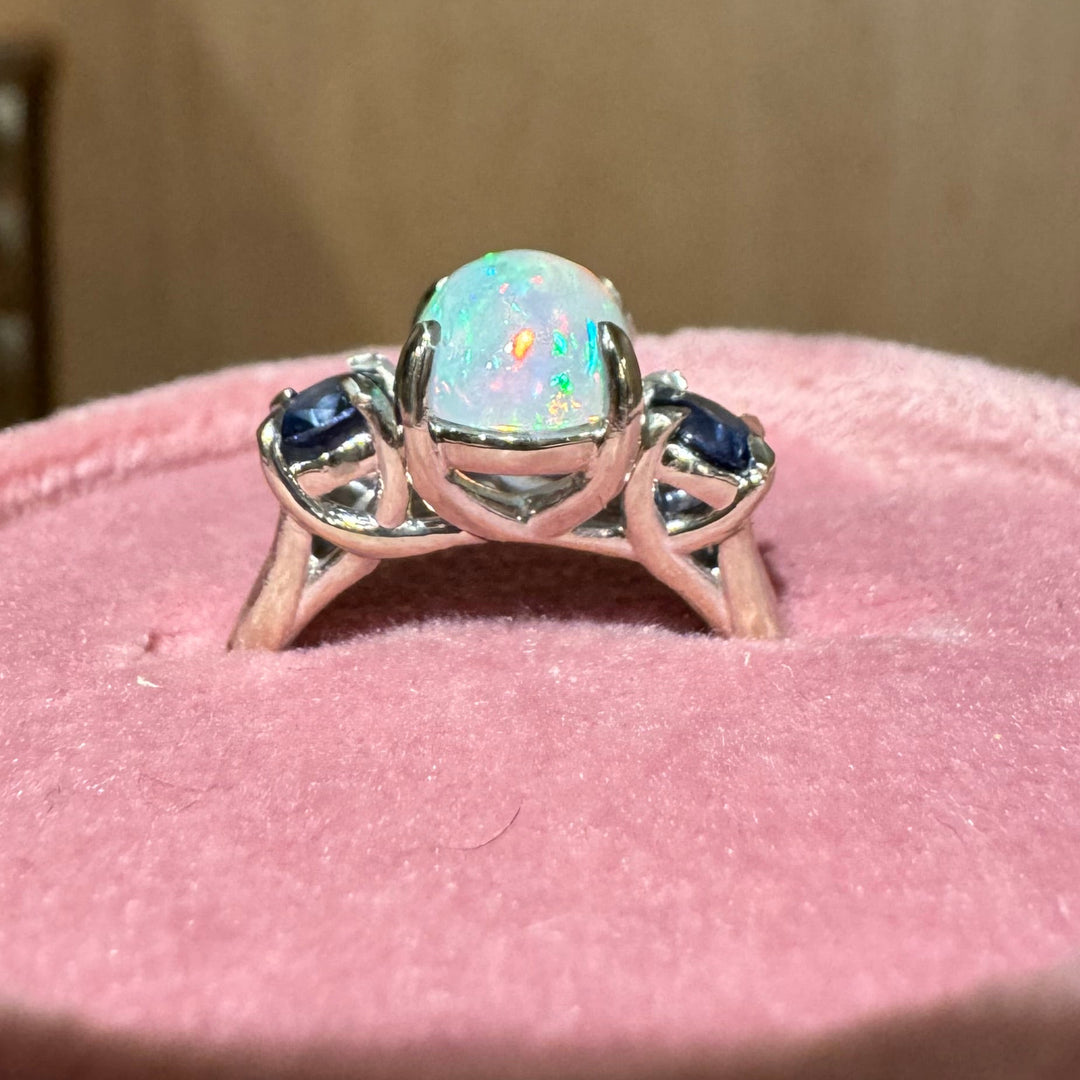 Handcrafted opal and sapphire ring in 14K white gold, angle view