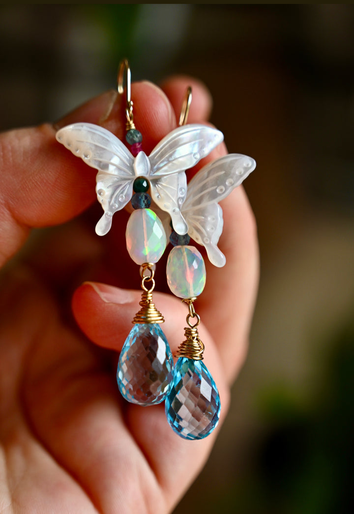 Opal, Swiss Blue topaz briolette drops, Mother of Pearl butterfly Earrings in 14K solid Gold. Handmade earrings by opalora jewelry. Long butterfly earrings, gold earrings.