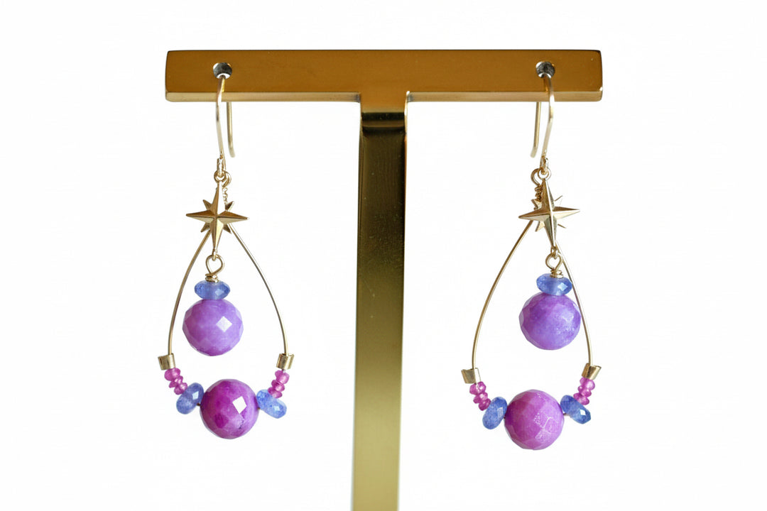 Close-up of natural untreated ruby stars with tanzanite beads and solid 14K gold accents