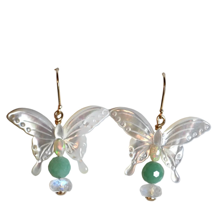 Get ready to flutter away with our exquisite 14K gold earrings featuring natural emeralds, opals, and moonstones in delicate butterfly shapes.

These beauties dangle at a length of 1 1/2 inches, perfect for adding a touch of whimsy to any outfit.
