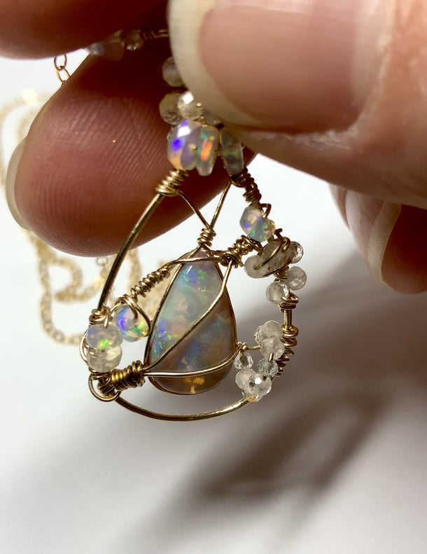 rare opal with air bubble inside. completly natural. gold wire wrapped necklace with crystal pipe opal from australia. Ethiopian opal beads. Aquamarine micro faceted beads. gold filled jewelry. opal jewelry.  AAA quality opals.